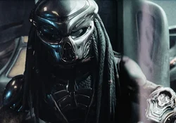 The Fugitive Predator sits in his ship in The Predator (2018)
