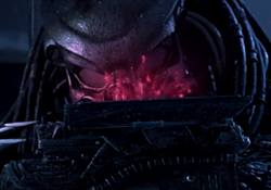 Celtic Predator studying a holographic map of the Antarctic temple in Alien vs. Predator