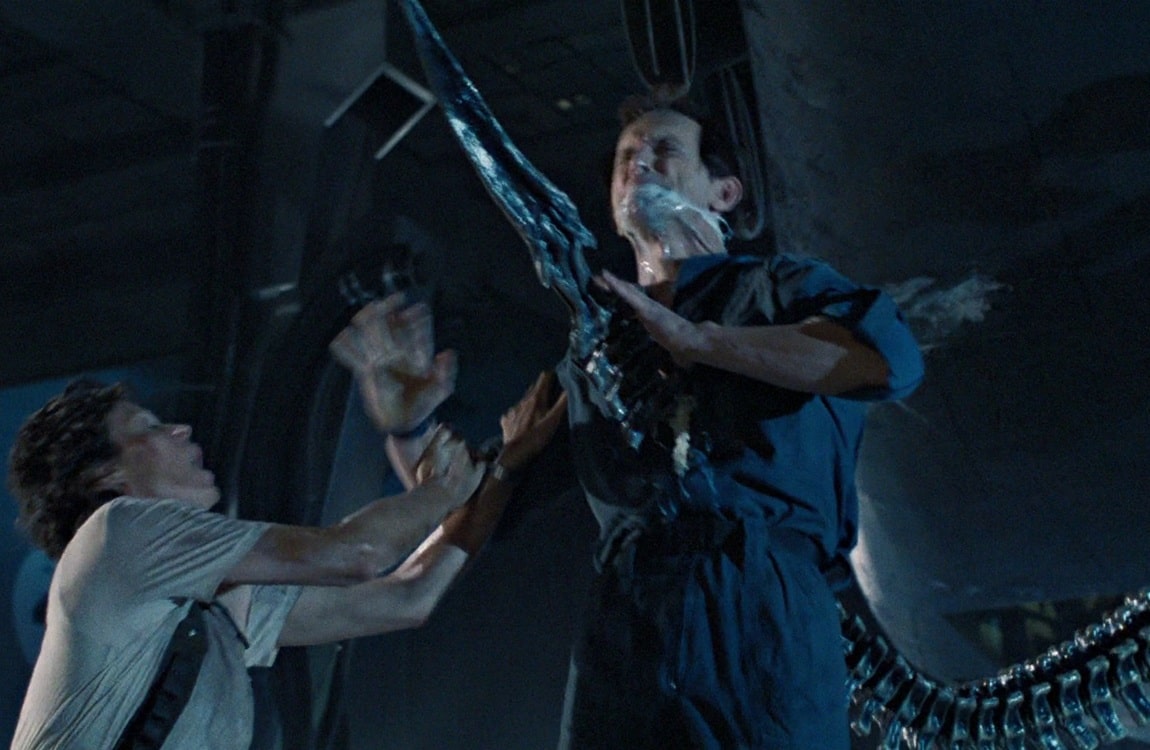 The Xenomorph Queen stabbing Bishop in Aliens